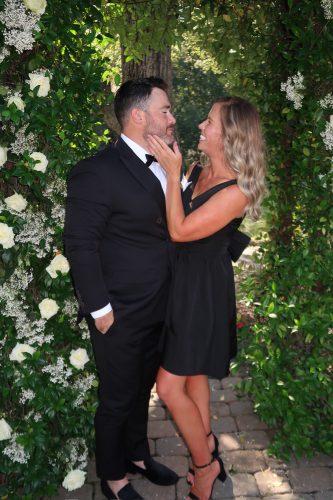 spray tanned couple candid